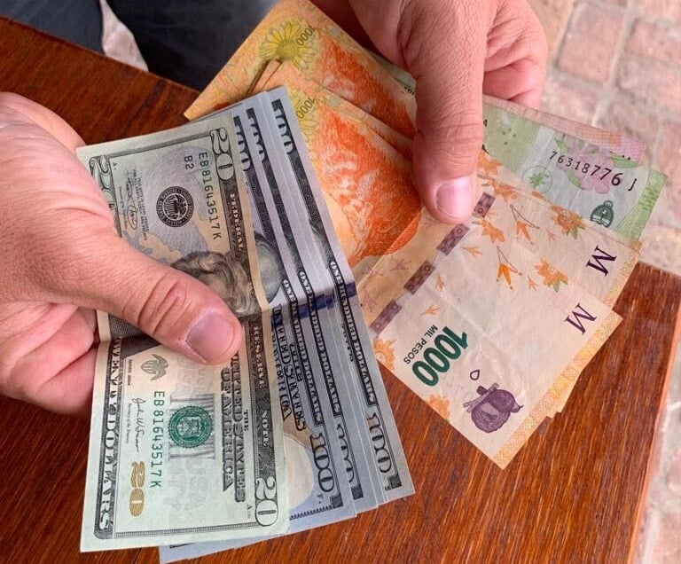 US dollars ($) versus Argentine pesos ($)