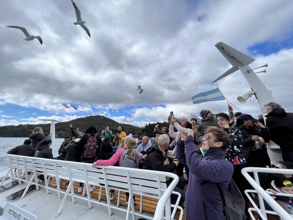 Boat passengers and gulls on Lake Nahuel Huapi