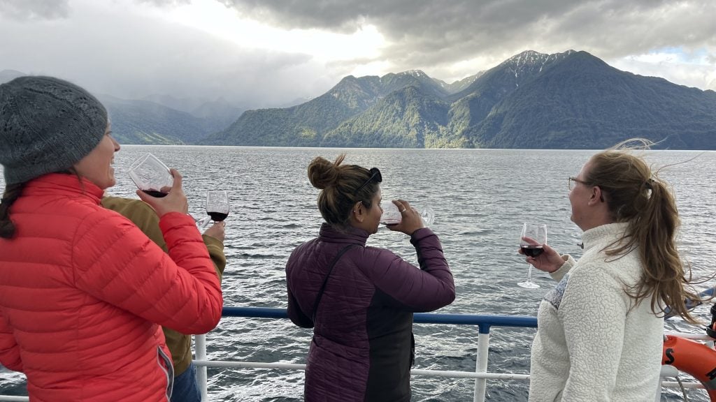 Ferry passengers drinking wine on Lake Todos los Santos in Chile