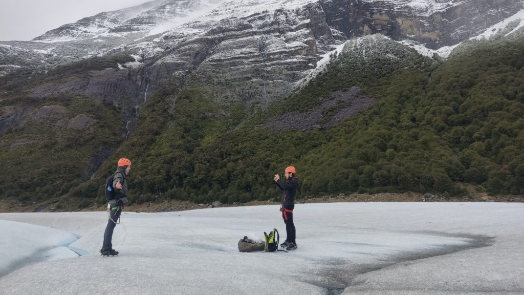 Two hikers on Perito Moreno glacier in Los Glaciares
