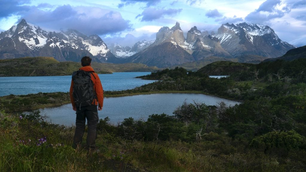 Hiker looking at the Paine Massif in Torres del Paine